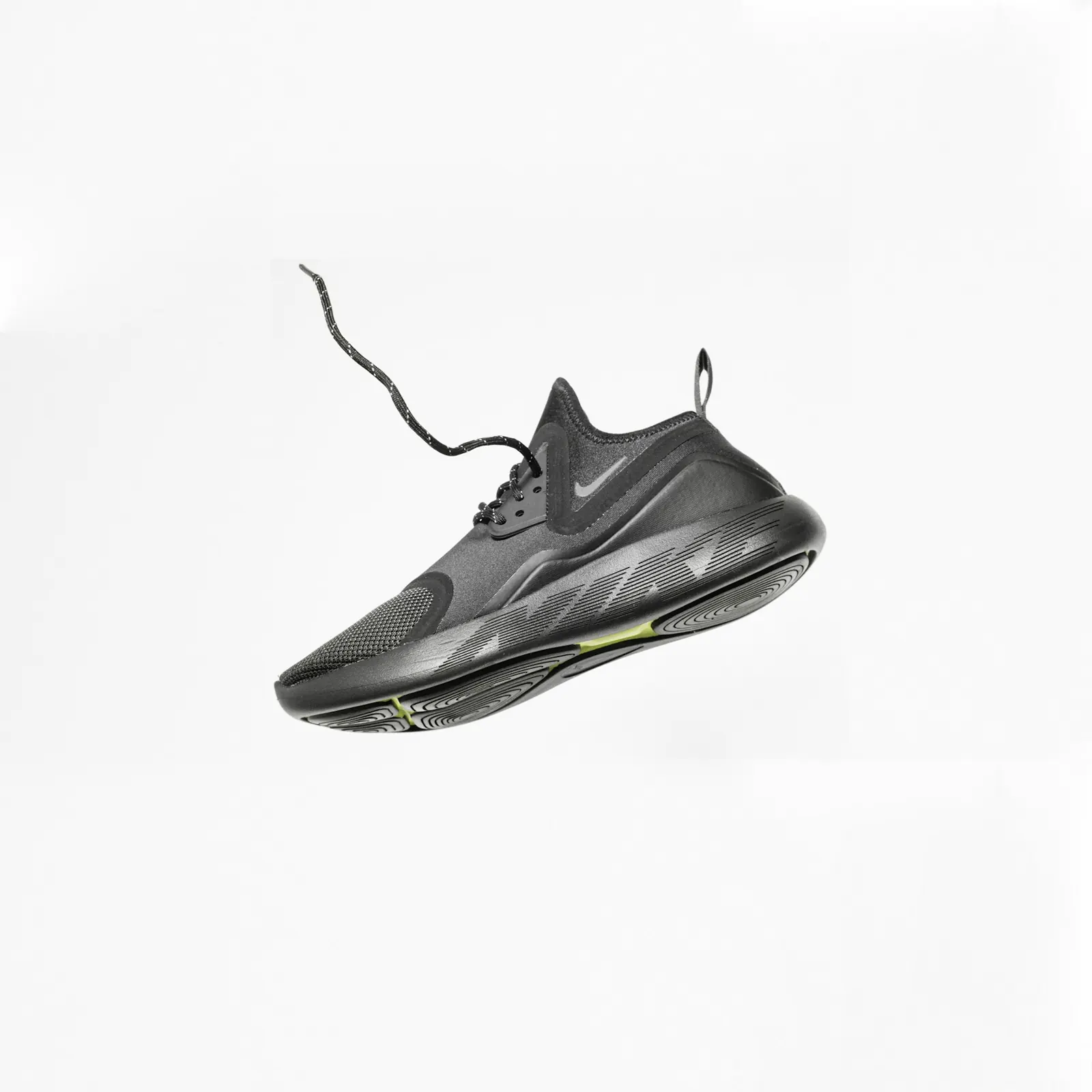 Black running shoe against a white background