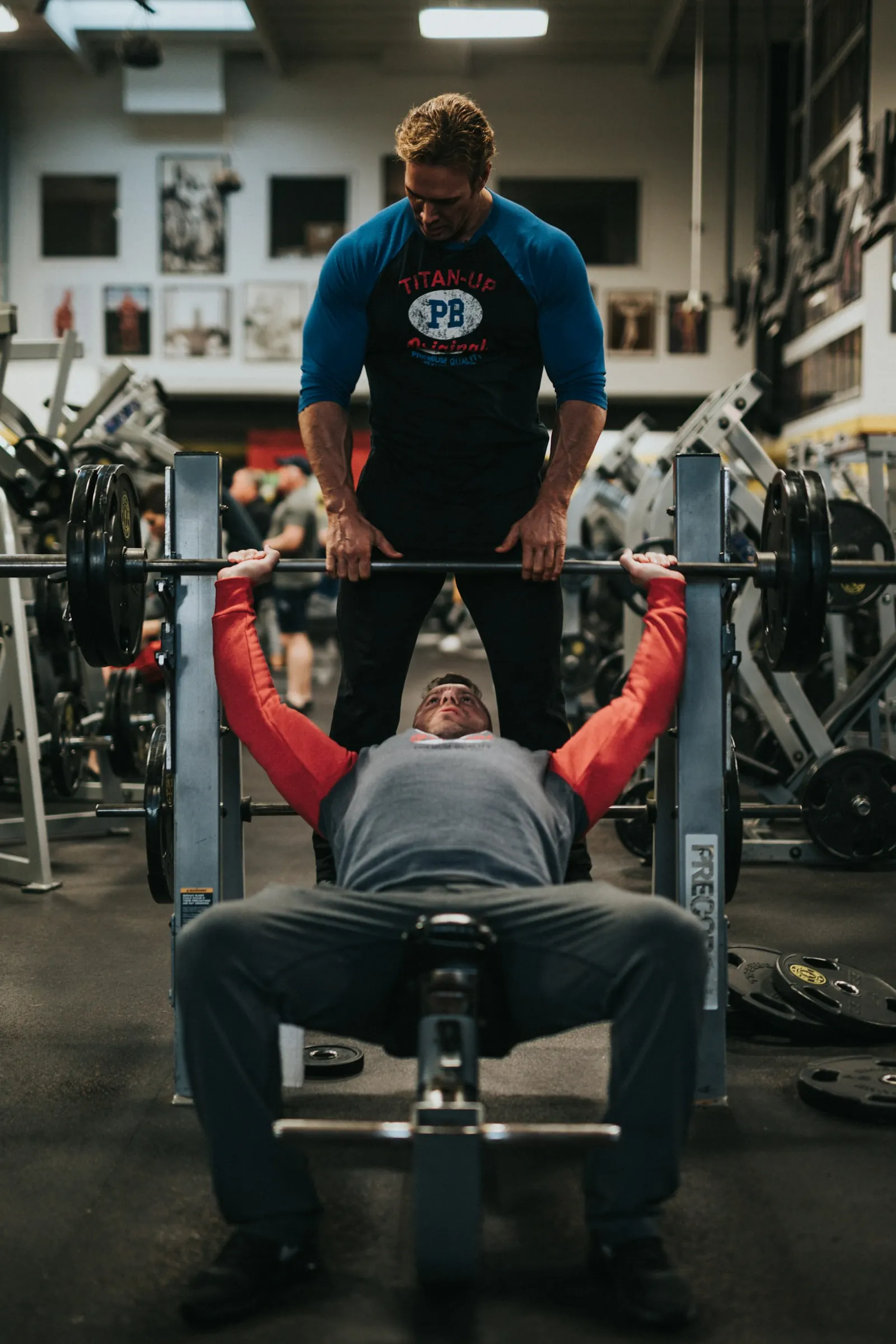 Man preparing for a heavy bench press in a gym